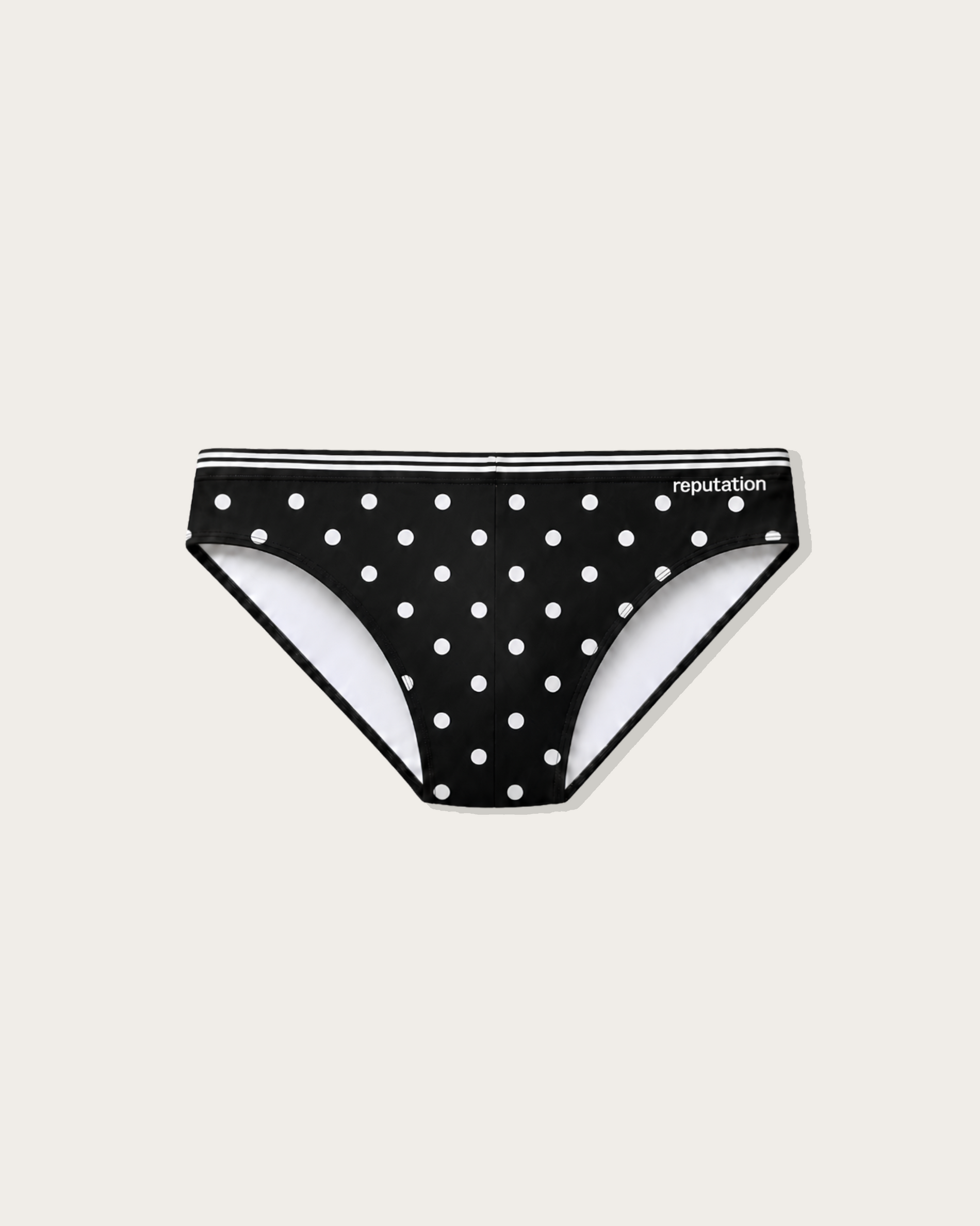 Reputation Signature Swim Brief 02 Polka Dots in black, flat lay