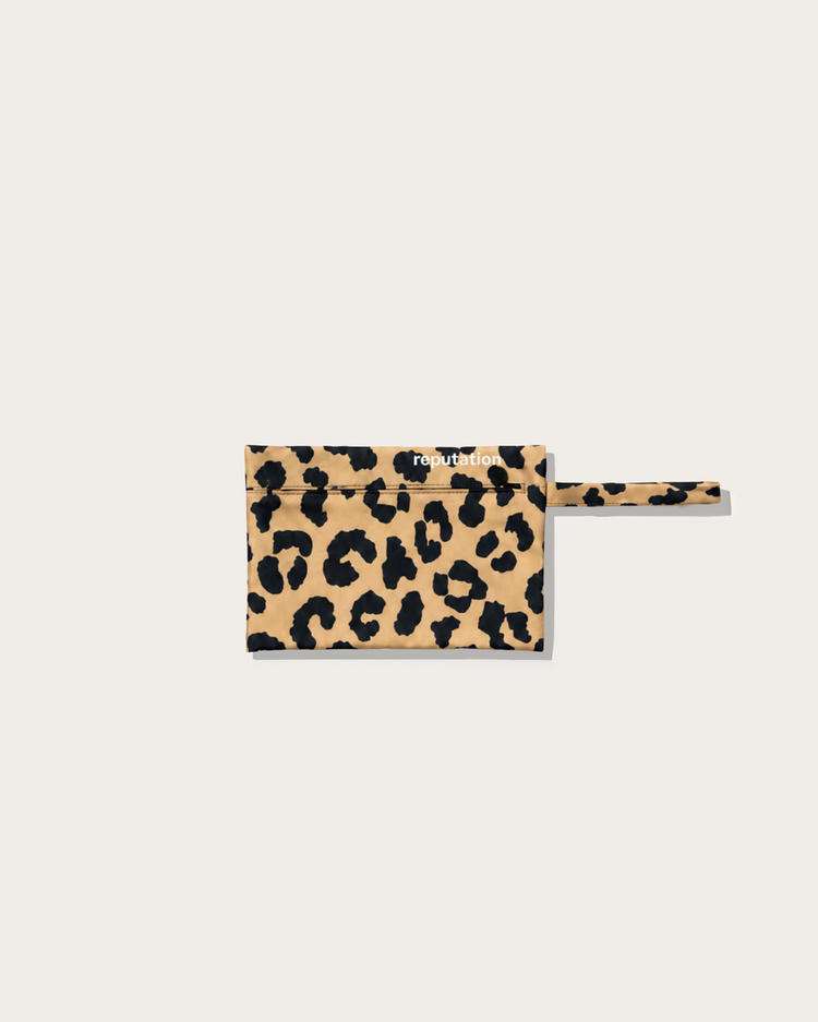 Reputation Leopard print swimwear packaging pouch, flat lay